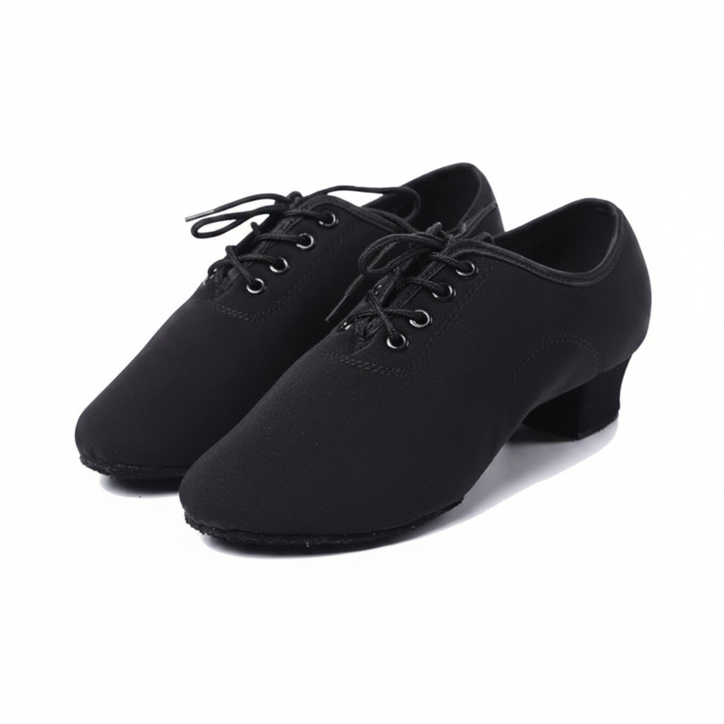 A pair of black dance shoes with a low block heel and lace-up front, shown on a white background with a circular inset detail of the fabric texture.